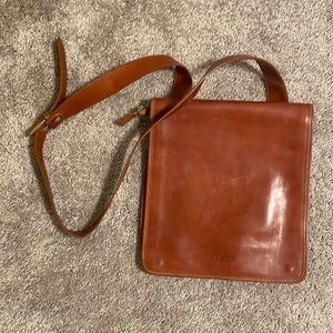 Large brown leather cross body satchel.